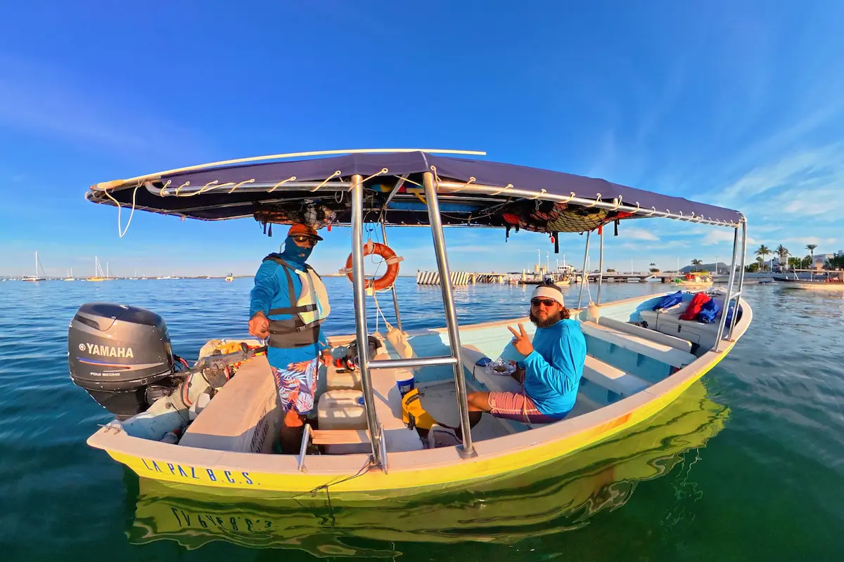 Snorkeling tour guides posing on their boat
